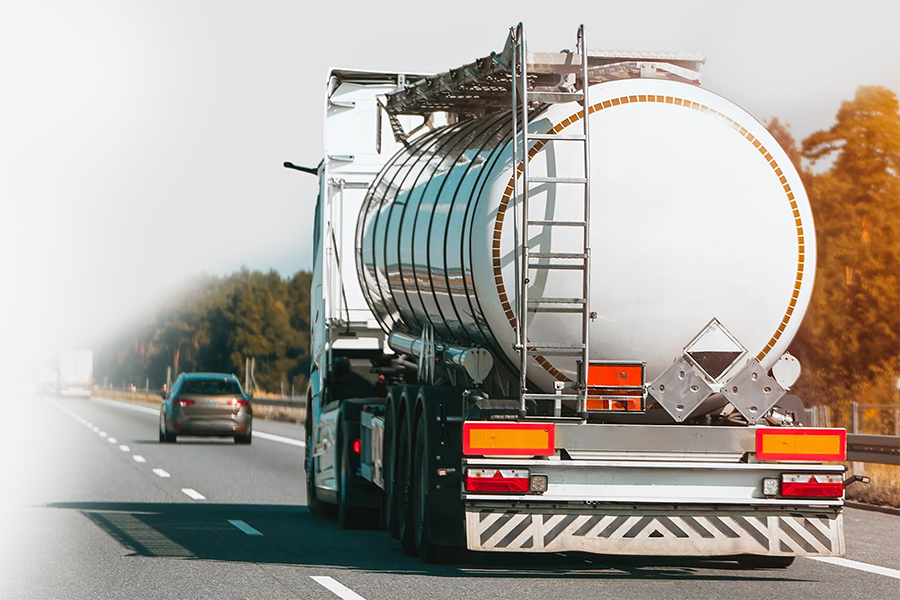 Fuel tanker truck on African highway at sunrise